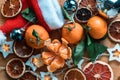 Festive background of citrus, garlands, dried fruits, Christmas and new year coming soon. Royalty Free Stock Photo