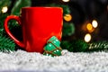 Festive background with a Cup of Tea and gingerbread tree on a snow Royalty Free Stock Photo