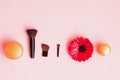 Festive background for decorative cosmetics. Cosmetic brushes and shadows on pastel pink background Royalty Free Stock Photo