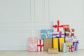 Festive background of many multicolored birthday gifts