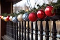 Festive balcony terrace decoration for Christmas and New Year. Close up of Christmas decoration balls and garland of Royalty Free Stock Photo