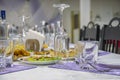 Festive banquet table served with cutlery, wine glasses and plates with appetizers. Royalty Free Stock Photo