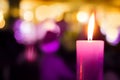 Festive Beautiful blurred Background with single burning candle Royalty Free Stock Photo