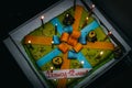 A festive beautiful cake with lighted multicolored birthday candles