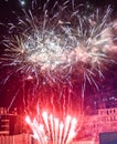 Festive beautiful fireworks at night over the city Royalty Free Stock Photo