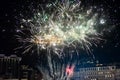 Festive beautiful fireworks at night over the city Royalty Free Stock Photo