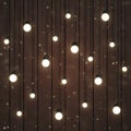 Beautiful Warm White Light Bulbs and Glow on Dark Brown Wood Texture