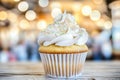 Festive Birthday Cupcake with Creamy Frosting on a Rustic Table with Soft Blurred Background Royalty Free Stock Photo