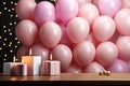 Festive birthday scene, frame, balloons, confetti, pink table, flat lay Royalty Free Stock Photo