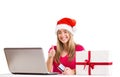 Festive blonde shopping online with laptop Royalty Free Stock Photo