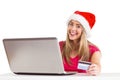 Festive blonde shopping online with laptop Royalty Free Stock Photo