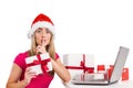 Festive blonde shopping online with laptop Royalty Free Stock Photo