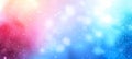 Festive bokeh lights background with pink and blue hues. Sparkling light particles. Concept of festive celebration Royalty Free Stock Photo