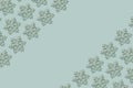 Festive border of wooden snowflakes on a blue background. Winter, Christmas, New Year concept Royalty Free Stock Photo