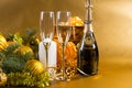 Festive Bottle of Champagne with Glasses and Gifts Royalty Free Stock Photo