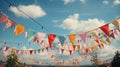 Festive bright multi-colored fairground festival flags on a blue sky