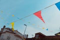 Festive bunting and lanterns decorate a narrow street for summer festival in June San Juan Royalty Free Stock Photo