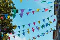 Festive bunting and lanterns decorate a narrow street for summer festival in June San Juan Royalty Free Stock Photo