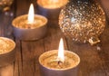 Golden Advent and Christmas decoration, candles with sparkling baubles Royalty Free Stock Photo