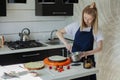 Festive cake decoration.A young woman is preparing cream for a cake. Cake. Royalty Free Stock Photo