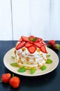 A festive cake with fresh strawberries, cream, decorated with mint leaves Royalty Free Stock Photo