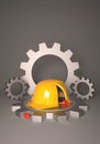 A festive cake in a yellow protective helmet shape on a grey gear background. Royalty Free Stock Photo
