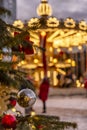 Festive carousel on Christmas holidays in the city square. Blurred. Vertical Royalty Free Stock Photo