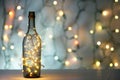 Festive champagne bottle with golden lights and Christmas decorations on bokeh background Royalty Free Stock Photo