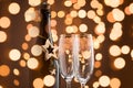 Festive Champagne bottle and two glasses. Fragment.