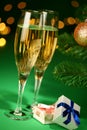 Festive champagne glasses with gifts Royalty Free Stock Photo