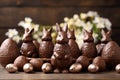 Festive Chocolate Bunnies and Easter Eggs on Wooden Table