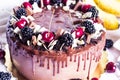 Festive chocolate cake with blackberry and sweet cherry on a white background. Top view