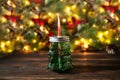 Festive christmas background, christmad tree bevarage bottle on wooden table with colorful bokeh led lights Royalty Free Stock Photo