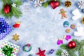 Festive Christmas background with fir branches, Christmas symbols, giftboxes, colorful decorations, copy space. Top view Royalty Free Stock Photo