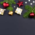 Festive Christmas background with fir branches, giftboxes, decorations, copy space, top view Royalty Free Stock Photo