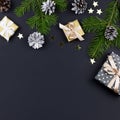 Festive Christmas background with fir branches, giftboxes, decorations, copy space, top view Royalty Free Stock Photo