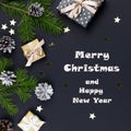 Festive Christmas background with fir branches, giftboxes, decorations, copy space, top view Royalty Free Stock Photo