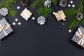 Festive Christmas background with fir branches, giftboxes, decorations, copy space, top view Royalty Free Stock Photo