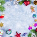 Festive Christmas background with fir branches, Christmas symbols, giftboxes, colorful decorations, copy space Royalty Free Stock Photo