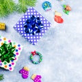 Festive Christmas background with fir branches, Christmas symbols, giftboxes, colorful decorations, copy space Royalty Free Stock Photo