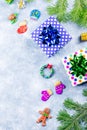 Festive Christmas background with fir branches, Christmas symbols, giftboxes, colorful decorations, copy space. Top view Royalty Free Stock Photo