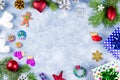 Festive Christmas background with fir branches, Christmas symbols, giftboxes, colorful decorations, copy space. Top view Royalty Free Stock Photo