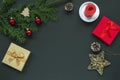 Festive Christmas background with gift boxes, fir tree, candle and baubles. Top view, copy space Royalty Free Stock Photo