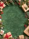 Festive Christmas Background with Gifts, Pine Cones, and Holiday Decorations on Green Textured Surface with Copy Space Royalty Free Stock Photo
