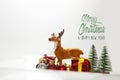 Festive christmas background with presents and reindeer Royalty Free Stock Photo
