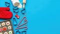 Festive christmas baking background with cookie cutters and candy canes on blue surface Royalty Free Stock Photo