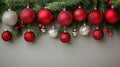 Festive Christmas Border with Red and Silver Balls Hanging in Fir Garland Royalty Free Stock Photo