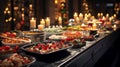 Festive Christmas buffet. Fine Dinner buffet table full of dishes with food, snacks, desserts, and drinks. Warm glow of