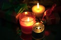 Festive christmas burning candles under the tree with gift box Royalty Free Stock Photo