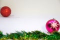 One pink,one red christmas balls, and Christmas decoration on a white background